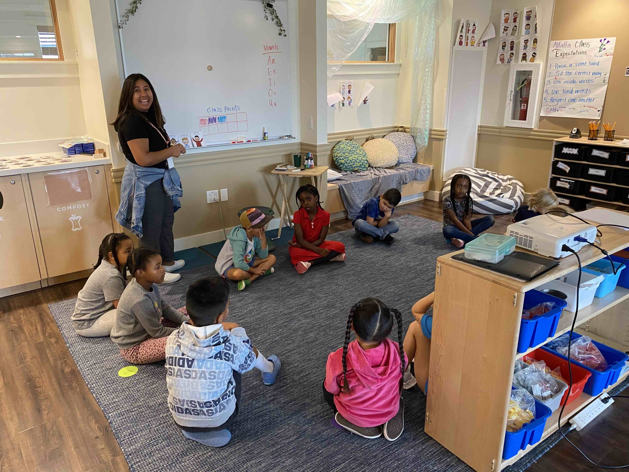 Students during circle time Students engaging and learning in natural environment